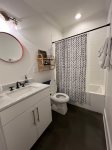 Full bathroom accessible to lower living room